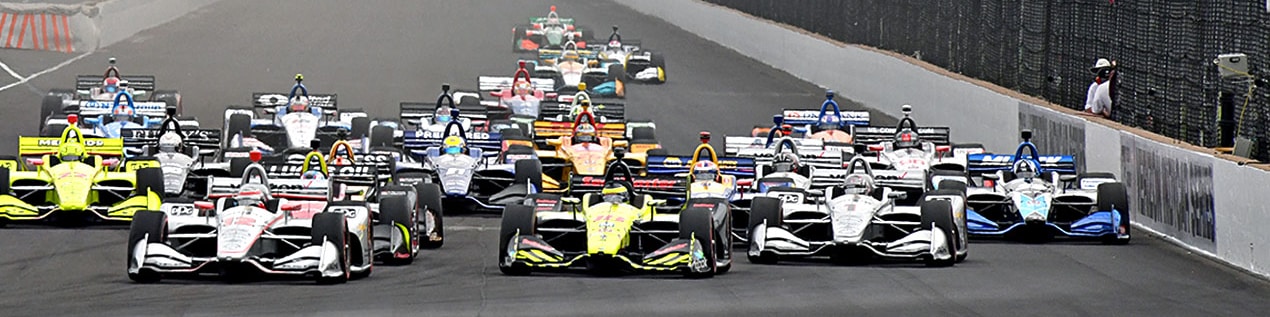 indy cars racing to through the start line Indianapolis