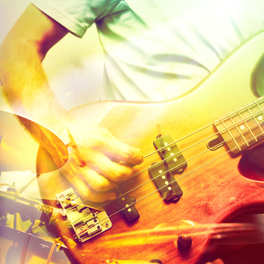 Up close shot of a guy playing an electric guitar